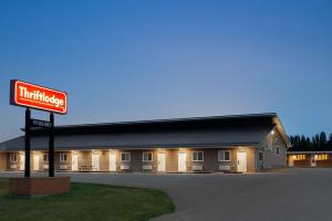 a fast food building with a sign in front of it at Thriftlodge Moose Jaw in Moose Jaw