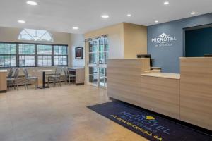 a lobby of a macdonalds restaurant with a counter at Microtel Inn & Suites by Wyndham Atlanta Buckhead Area in Atlanta