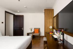 Postel nebo postele na pokoji v ubytování Roliva Hotel & Apartment Danang