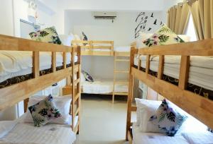 a dorm room with two bunk beds in it at Kamusta Boutique Hotel in Boracay