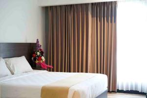 Voodi või voodid majutusasutuse Yunna Hotel Lampung toas
