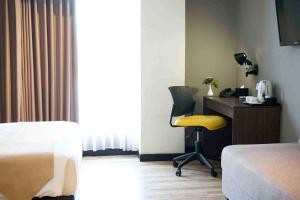 Voodi või voodid majutusasutuse Yunna Hotel Lampung toas