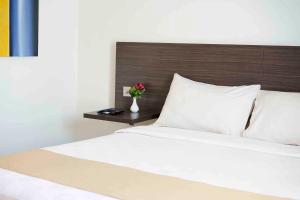 Voodi või voodid majutusasutuse Yunna Hotel Lampung toas