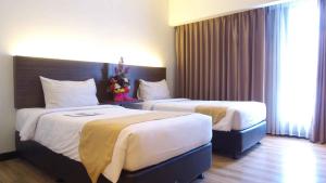 Voodi või voodid majutusasutuse Yunna Hotel Lampung toas