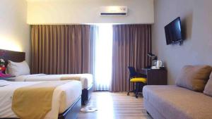 Voodi või voodid majutusasutuse Yunna Hotel Lampung toas