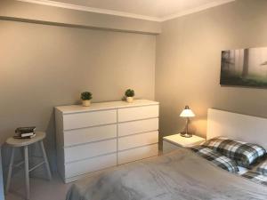 A bed or beds in a room at Notodden Sentrum Apartment NO 2