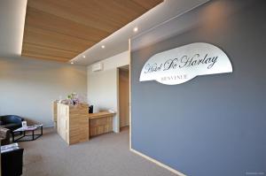 a waiting room with a pharmacy sign on the wall at Cit'Hotel De Harlay in Compiègne