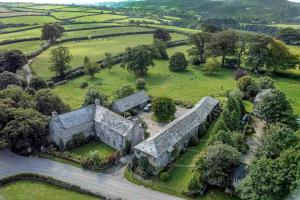 an aerial view of an old building in a field at The Forge at Trevadlock Manor in Lewannick