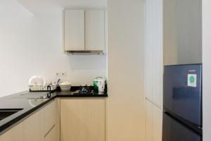 Kuchyň nebo kuchyňský kout v ubytování Elegant Best View 1BR Branz BSD City Apartment By Travelio
