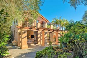 an exterior view of a house with a garden at San Marco Luxury Tuscan Beachside Villa in Whangamata