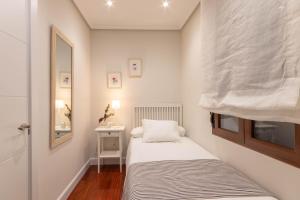 Кровать или кровати в номере RIBERA MARKET by ALOHA Bilbao