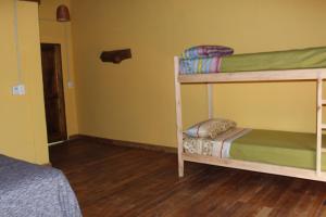 Postel nebo postele na pokoji v ubytování Yateí-house