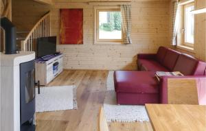 Televízia a/alebo spoločenská miestnosť v ubytovaní Gemuetliches Almhaus