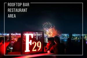 a sign that says roof top bar restaurant with fireworks at Wyndham Danang Golden Bay in Da Nang