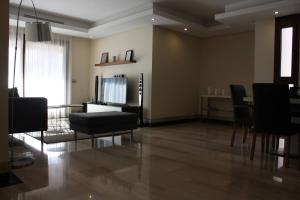 A television and/or entertainment centre at 110 - Beach Two-Bedroom Apartment
