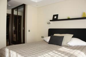 A bed or beds in a room at 110 - Beach Two-Bedroom Apartment