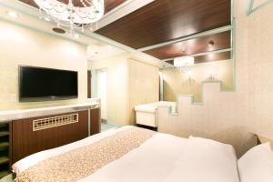 Postel nebo postele na pokoji v ubytování Hotel Luna (Adult Only)