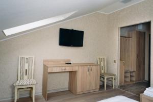 TV a/nebo společenská místnost v ubytování Готель Hunter