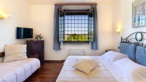 Postel nebo postele na pokoji v ubytování Abbazia Collemedio Resort & Spa