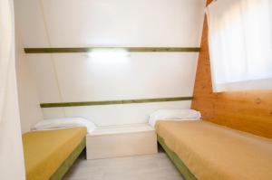 Postel nebo postele na pokoji v ubytování Camping Relax Ge + 24 fotografií