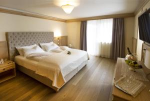 Ένα ή περισσότερα κρεβάτια σε δωμάτιο στο Hotel Lorenzetti