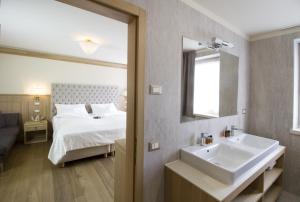 Ένα ή περισσότερα κρεβάτια σε δωμάτιο στο Hotel Lorenzetti