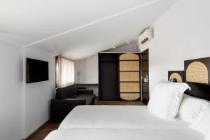 Postel nebo postele na pokoji v ubytování Hotel Astoria