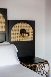 Postel nebo postele na pokoji v ubytování Hotel Astoria