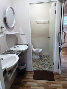 a bathroom with a toilet and a sink and a shower at Sairee Center Guest House in Ko Tao