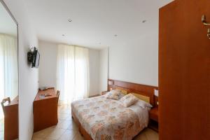 Postel nebo postele na pokoji v ubytování B&B Anna Lungomare