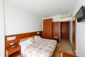 Postel nebo postele na pokoji v ubytování B&B Anna Lungomare