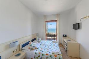 Postel nebo postele na pokoji v ubytování B&B Anna Lungomare