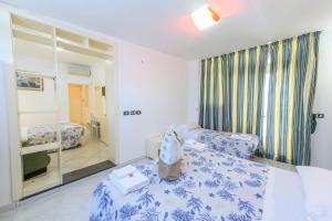 Postel nebo postele na pokoji v ubytování B&B Anna Lungomare