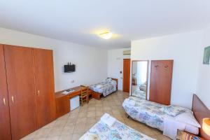 Postel nebo postele na pokoji v ubytování B&B Anna Lungomare