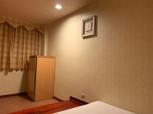 Postel nebo postele na pokoji v ubytování Dong Zhi Gang Motel