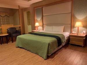 Postel nebo postele na pokoji v ubytování Dong Zhi Gang Motel