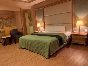 Postel nebo postele na pokoji v ubytování Dong Zhi Gang Motel