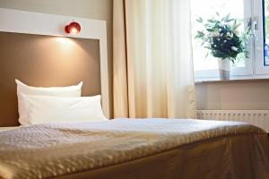 Voodi või voodid majutusasutuse Hotel Domicil Hamburg by Golden Tulip toas