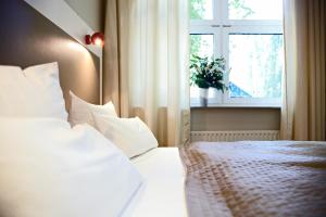 Voodi või voodid majutusasutuse Hotel Domicil Hamburg by Golden Tulip toas