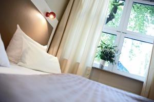 Voodi või voodid majutusasutuse Hotel Domicil Hamburg by Golden Tulip toas