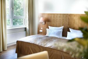 Voodi või voodid majutusasutuse Hotel Domicil Hamburg by Golden Tulip toas
