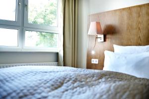 Voodi või voodid majutusasutuse Hotel Domicil Hamburg by Golden Tulip toas