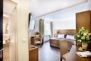 Voodi või voodid majutusasutuse Hotel Domicil Hamburg by Golden Tulip toas