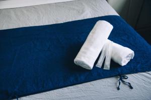 Letto o letti in una camera di Nui. HOSTEL & BAR LOUNGE