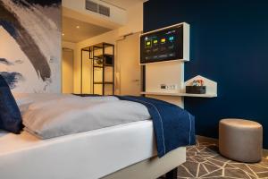 Postel nebo postele na pokoji v ubytování Holiday Inn - the niu, Ridge Halle Central Station by IHG + 37 fotografií