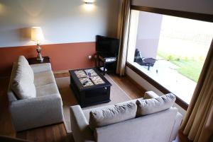 TV a/nebo společenská místnost v ubytování Apartamentos La Senda