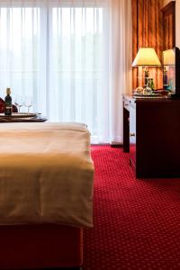 Łóżko lub łóżka w pokoju w obiekcie Royal Park Hotel & Spa