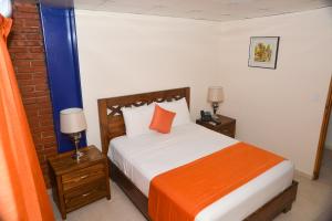 Tempat tidur dalam kamar di Hotel Jaraba