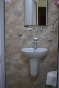 a bathroom with a sink and a mirror at Sur Istanbul Hotel in Istanbul +24 photos