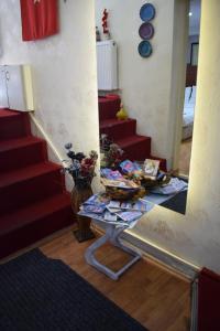 a living room with a table and some stairs at Sur Istanbul Hotel in Istanbul